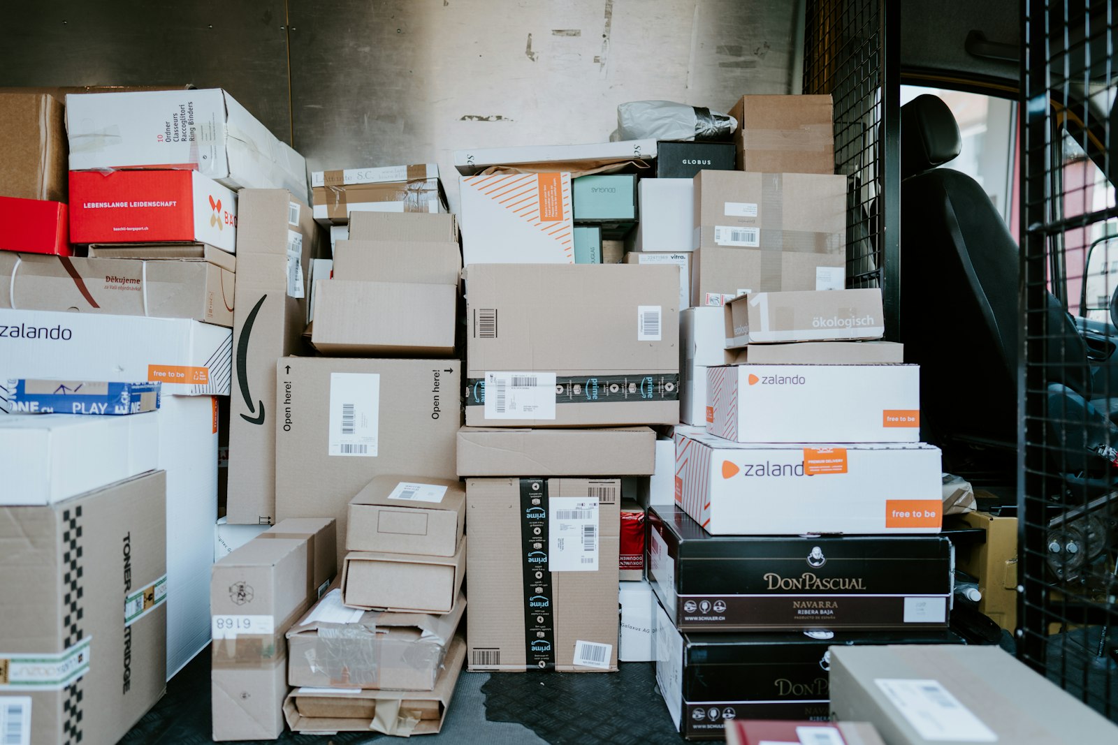 Parcels and boxes loaded in the back of a delivery van